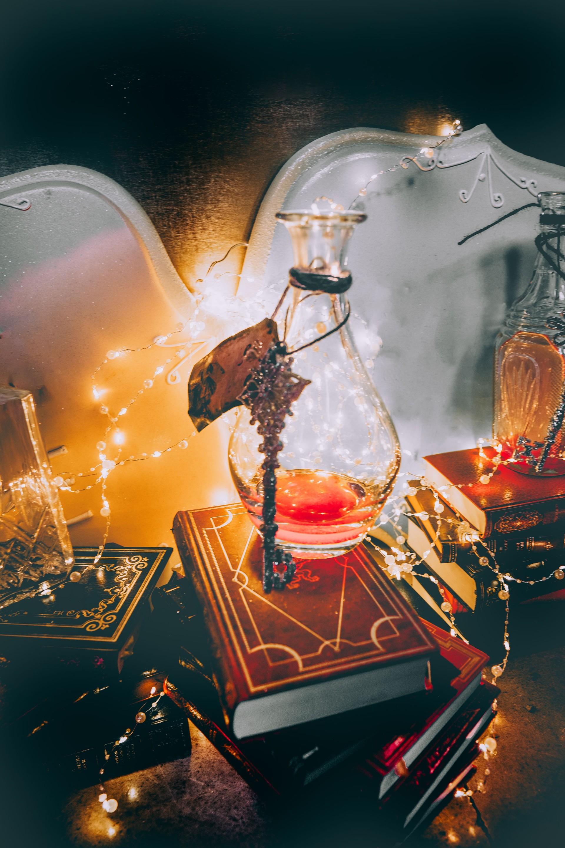 A Pile Of Spell Books & A Flask